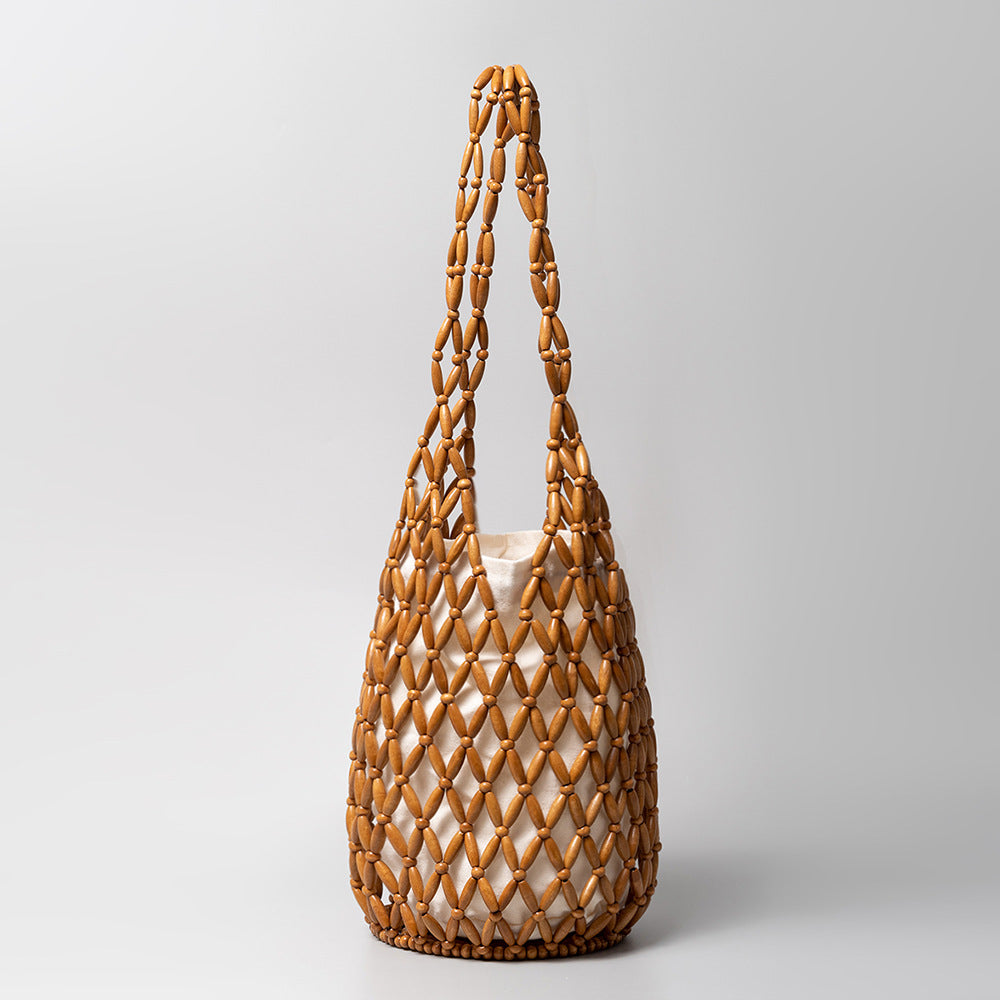 Woven bag women's summer niche design hollow wooden bead bag portable bucket shoulder bag