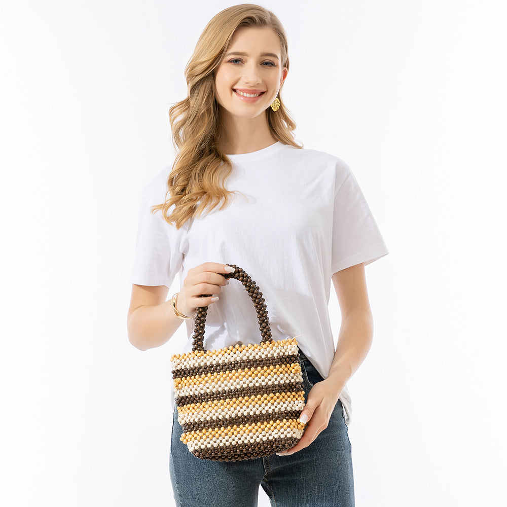 Hand-held wooden bead bag, seaside beach vacation bag, ladies' high-end exquisite hand-woven bag