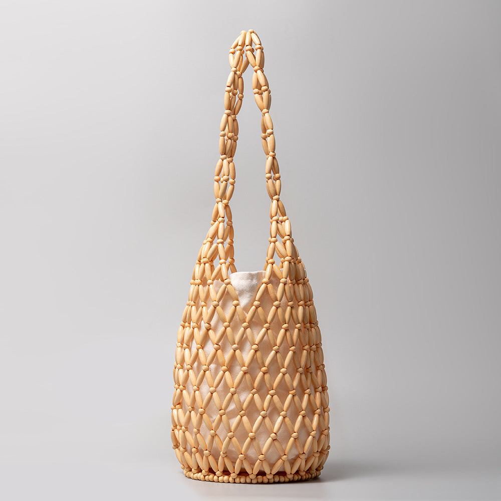 Woven bag women's summer niche design hollow wooden bead bag portable bucket shoulder bag