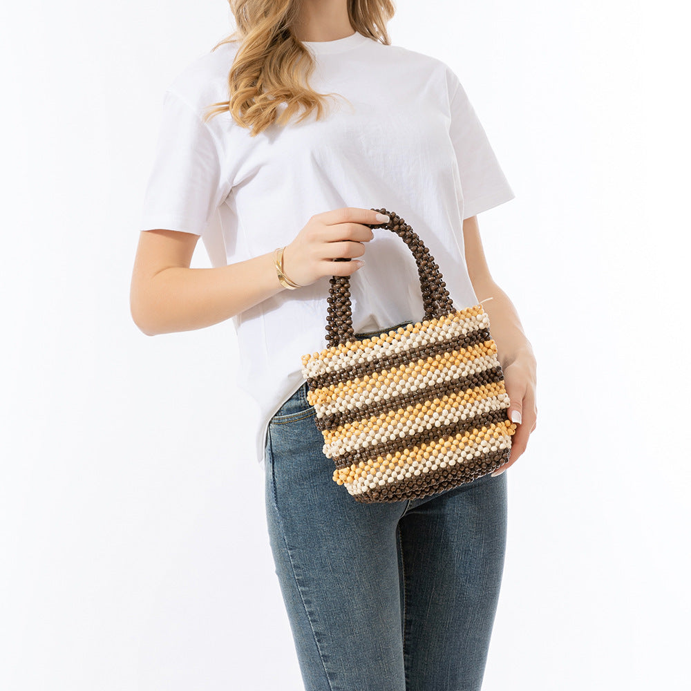 Hand-held wooden bead bag, seaside beach vacation bag, ladies' high-end exquisite hand-woven bag