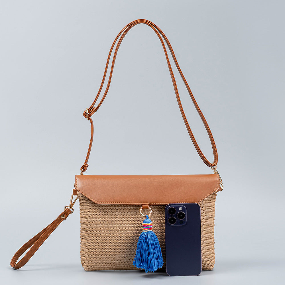 Beach straw bag tassel woven bag women's high-end exquisite shoulder bag seaside holiday clutch bag